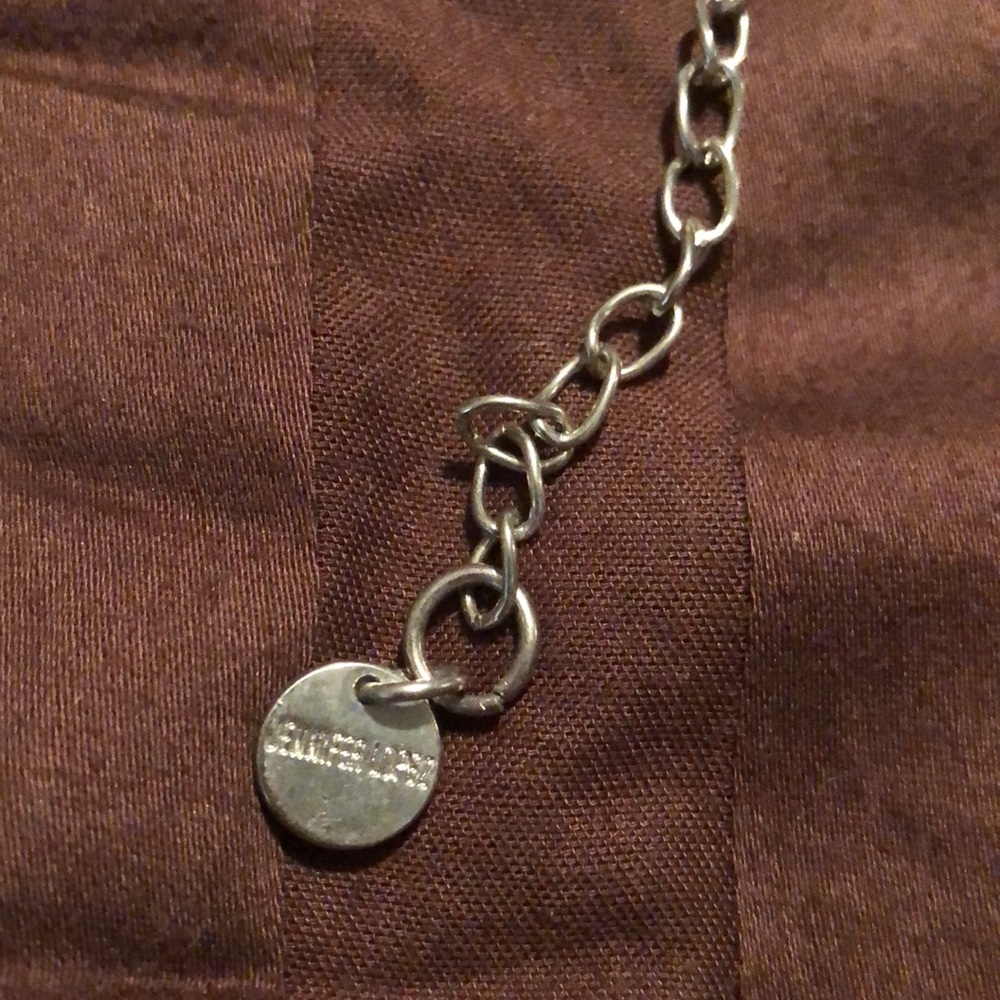 Jennifer Lopez. Silver tone necklace, possibly a belt. - Picture 2 of 5